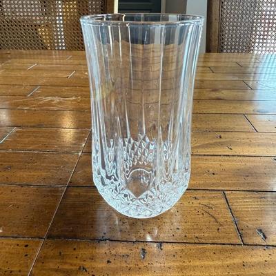 Sale Photo Thumbnail #125: Stylish vertical-ribbed tall glasses with crystal-cut detailing at the base. A timeless addition to any table.