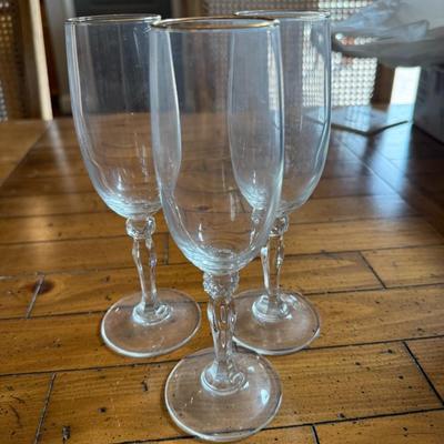Sale Photo Thumbnail #129: Delicate stemware with twisted stems and a gold rim detail. Light and graceful—great for vintage-style entertaining.