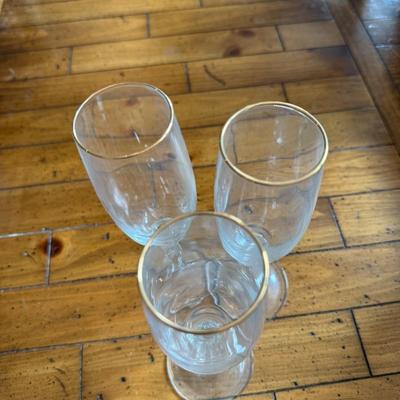 Sale Photo Thumbnail #130: Delicate stemware with twisted stems and a gold rim detail. Light and graceful—great for vintage-style entertaining.
