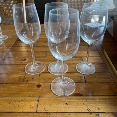 Sale Photo Thumbnail #135: Beautiful clear wine glasses with etched floral detailing. Tall stems and wide bowls make them ideal for red or white wine.
