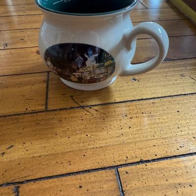 Sale Photo Thumbnail #141: Charming souvenir-style ceramic mug with a winter village scene and interior volume marking. Likely from a European Christmas market (0.2L marking)