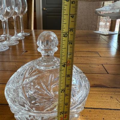 Sale Photo Thumbnail #147: Stunning vintage-style candy dish with a floral cut-glass pattern and matching lid. Adds a touch of classic elegance to any space.