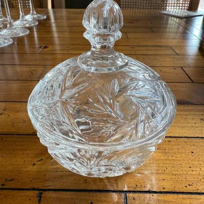 Sale Photo Thumbnail #146: Stunning vintage-style candy dish with a floral cut-glass pattern and matching lid. Adds a touch of classic elegance to any space.