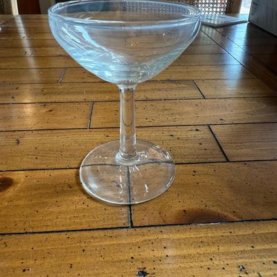 Sale Photo Thumbnail #150: Classic coupe cocktail glasses with a shallow, wide bowl—ideal for serving champagne, martinis, or vintage cocktails. Light etching on the glass adds a touch of elegance.