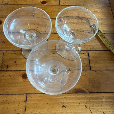 Sale Photo Thumbnail #149: Classic coupe cocktail glasses with a shallow, wide bowl—ideal for serving champagne, martinis, or vintage cocktails. Light etching on the glass adds a touch of elegance.