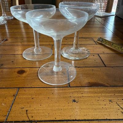Sale Photo Thumbnail #148: Classic coupe cocktail glasses with a shallow, wide bowl—ideal for serving champagne, martinis, or vintage cocktails. Light etching on the glass adds a touch of elegance.