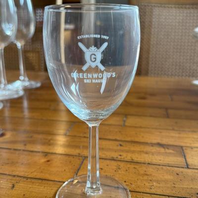 Sale Photo Thumbnail #153: Statement wine glasses from Greenwood’s Ski Haus featuring a double-crossed ski pole logo. Oversized and fun for winter décor, themed events, or as conversation pieces.