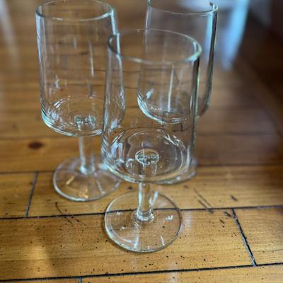 Sale Photo Thumbnail #154: Sleek and contemporary, these stemmed wine glasses feature a clean cylindrical bowl design perfect for a minimalist aesthetic. Great for white or red wines.