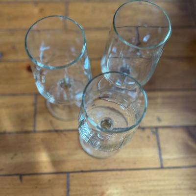 Sale Photo Thumbnail #155: Sleek and contemporary, these stemmed wine glasses feature a clean cylindrical bowl design perfect for a minimalist aesthetic. Great for white or red wines.