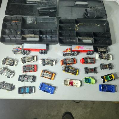 Large Lot of AFX Slot Cars and Trucks w 2 hard shell cases