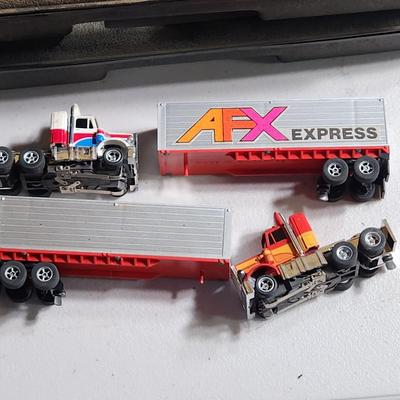 Large Lot of AFX Slot Cars and Trucks w 2 hard shell cases