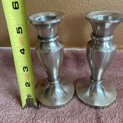 Clear glass serving dishes and silver tone candle stick holders