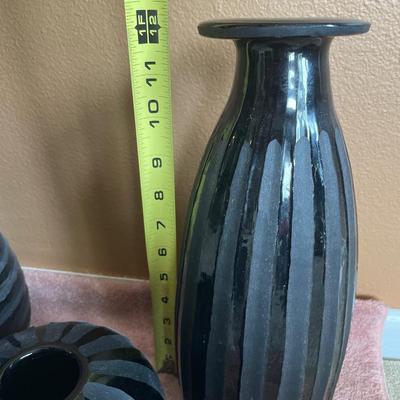 Black heavy vases and letter S
