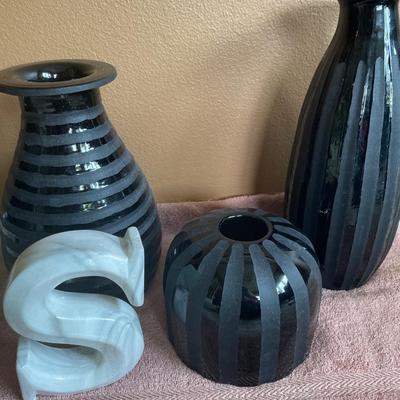 Black heavy vases and letter S
