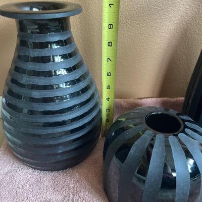 Black heavy vases and letter S