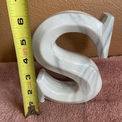 Black heavy vases and letter S