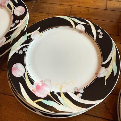 Sale Photo Thumbnail #180: Elegant porcelain dinnerware with black border and soft pink tulip pattern. Service for 4–6 includes plates, bowls, mugs, and serving pieces. Marked "Westbrook Collections - Mirage - Japan".