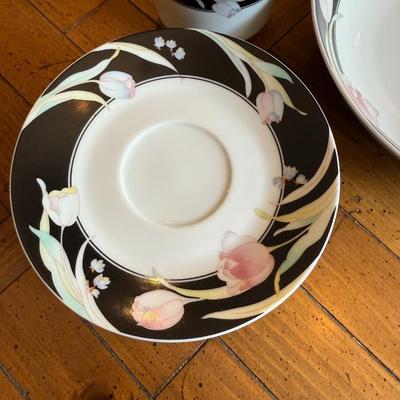 Sale Photo Thumbnail #188: Elegant porcelain dinnerware with black border and soft pink tulip pattern. Service for 4–6 includes plates, bowls, mugs, and serving pieces. Marked "Westbrook Collections - Mirage - Japan".
