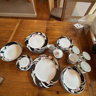 Sale Photo Thumbnail #191: Elegant porcelain dinnerware with black border and soft pink tulip pattern. Service for 4–6 includes plates, bowls, mugs, and serving pieces. Marked "Westbrook Collections - Mirage - Japan".