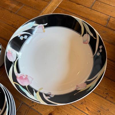 Sale Photo Thumbnail #186: Elegant porcelain dinnerware with black border and soft pink tulip pattern. Service for 4–6 includes plates, bowls, mugs, and serving pieces. Marked "Westbrook Collections - Mirage - Japan".