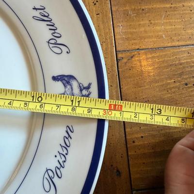 Sale Photo Thumbnail #195: Classic white and blue ceramic plates with French words and illustrations for meats and seafood (Poulet, Boeuf, Poisson, etc.). Bistro-style charm for kitchen or display.
