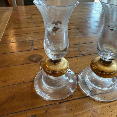 Sale Photo Thumbnail #198: Elegant pair of fluted glass bud vases with gold tone bases. Vintage charm with minor patina.