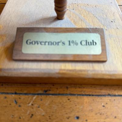 Sale Photo Thumbnail #208: Set of three vintage mugs with gold trim and the Great Seal of Idaho. Displayed on wood stand labeled “Governor’s 1% Club.