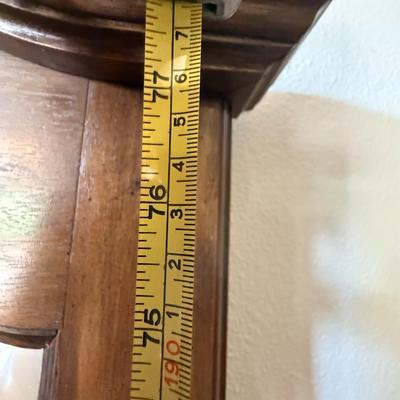 Sale Photo Thumbnail #219: Solid wood hall tree with upper hooks, central mirror, and umbrella stand base. Perfect for entryway organization.