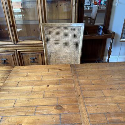 Sale Photo Thumbnail #225: Rustic wood dining table with plank inlay top and matching chairs (6 total). Leaf included for extended seating.