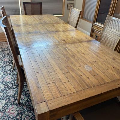 Sale Photo Thumbnail #223: Rustic wood dining table with plank inlay top and matching chairs (6 total). Leaf included for extended seating.