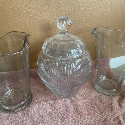 Clear glass jar with lid and 2 glass pitchers