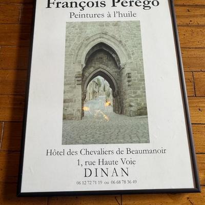 Sale Photo Thumbnail #258: Large framed French exhibition poster featuring a stone gothic archway. Text indicates it’s from a 2000s exhibition in Dinan, France. Minimalist black frame.