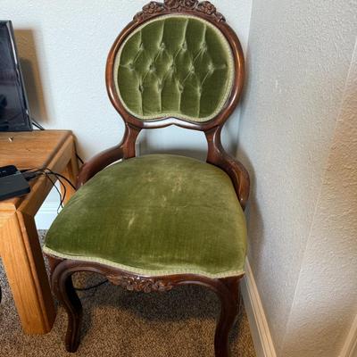 Sale Photo Thumbnail #290: Gorgeous carved wood frame with button-tufted green velvet upholstery. Some wear on seat fabric consistent with age.