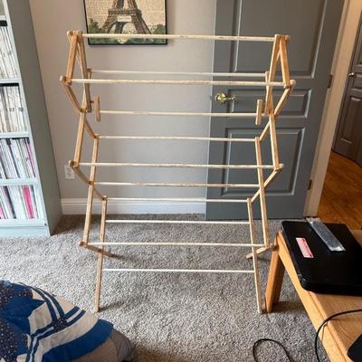 Sale Photo Thumbnail #321: Vintage-style wooden drying rack with foldable design. Functional and great for farmhouse or rustic laundry rooms.