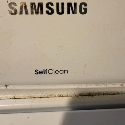 Sale Photo Thumbnail #335: Samsung top-load washer with multiple cycle settings. Light wear on top; appears functional.