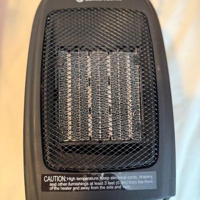 Sale Photo Thumbnail #349: Compact 1500W ceramic space heater with safety features, adjustable thermostat, and two heat settings. Perfect for small rooms