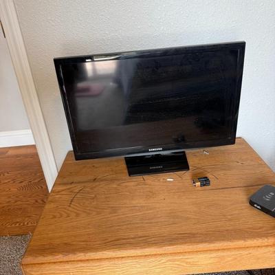 Sale Photo Thumbnail #360: Flat-screen Samsung TV. Powers on and in working condition. Minor wear. Remote not shown.