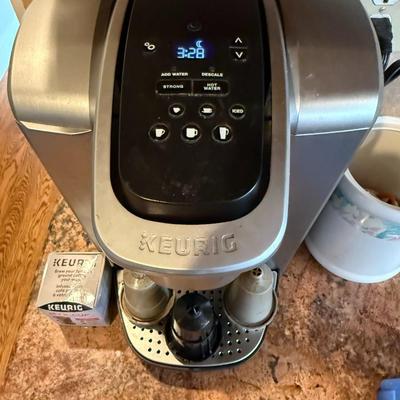 Sale Photo Thumbnail #361: Keurig single-serve brewer with digital interface, multiple cup size options, and iced/strong settings. Includes reusable K-cup.