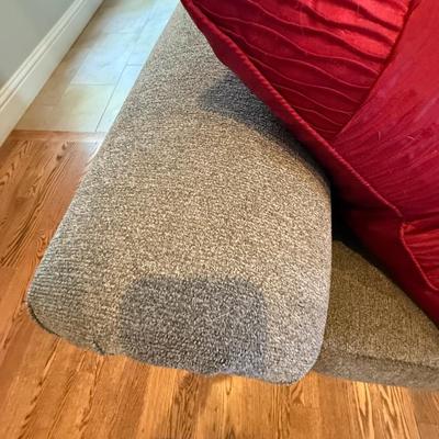 Sale Photo Thumbnail #380: Neutral-toned sofa with rolled arms and nailhead trim, includes four accent pillows. Excellent condition.