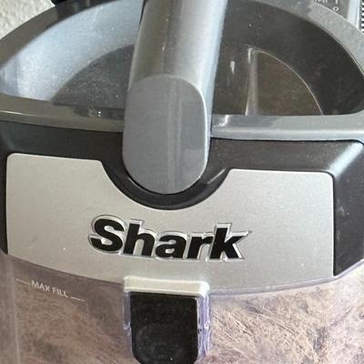 Sale Photo Thumbnail #420: Shark upright vacuum cleaner with Lift-Away feature for handheld use. Great suction power and rotating PowerFins brush roll—ideal for deep cleaning carpet and hard floors. Lightly used and in working condition.