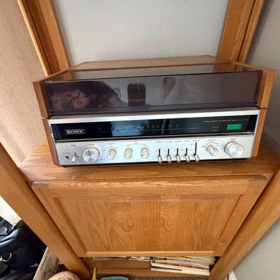 Sale Photo Thumbnail #421: Vintage Sony stereo receiver encased in a built-in wood cabinet with display shelf below. Retro charm meets function—perfect for audiophiles, collectors, or as a unique media console.