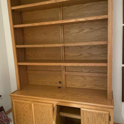 Tall wood shelving with storage on bottom