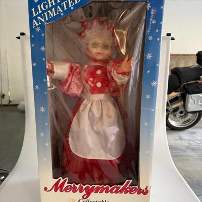 Sale Photo Thumbnail #437: Charming lighted and animated Mrs. Claus figure by Merrymakers. A great collectible piece for holiday décor. In original box, plastic window has wear.