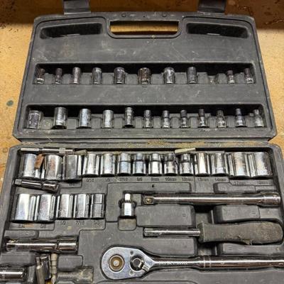 Sale Photo Thumbnail #441: Well-used socket and ratchet set in a durable molded plastic case. Includes various socket sizes and attachments. Great for everyday repairs.