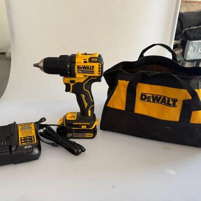 Sale Photo Thumbnail #444: DeWalt 20V brushless cordless drill with battery, charger, and branded bag. Clean and in working condition.