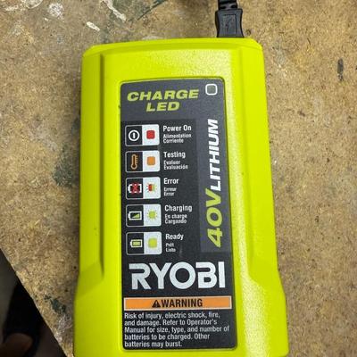 Sale Photo Thumbnail #448: High-power Ryobi 40V hedge trimmer with battery. Perfect for trimming thick branches or overgrowth.