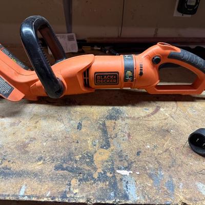 Sale Photo Thumbnail #449: Reliable corded Black + Decker electric hedge trimmer. Lightweight and efficient for yard maintenance.
