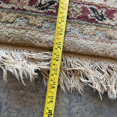 Sale Photo Thumbnail #467: Large area rug with traditional floral pattern. Visible wear on fringe but still a beautiful piece.