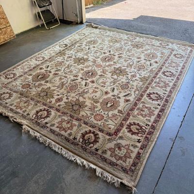 Sale Photo Thumbnail #465: Large area rug with traditional floral pattern. Visible wear on fringe but still a beautiful piece.