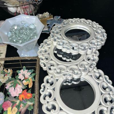 Sale Photo Thumbnail #81: Large glass bowl, metal flowers, mirrors, hummingbird magnets in metal basket, milk glass pedestal bowl, pretty dish, small windchimes and cross ornaments